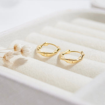Twisted Huggie Hoop Earrings in Gold